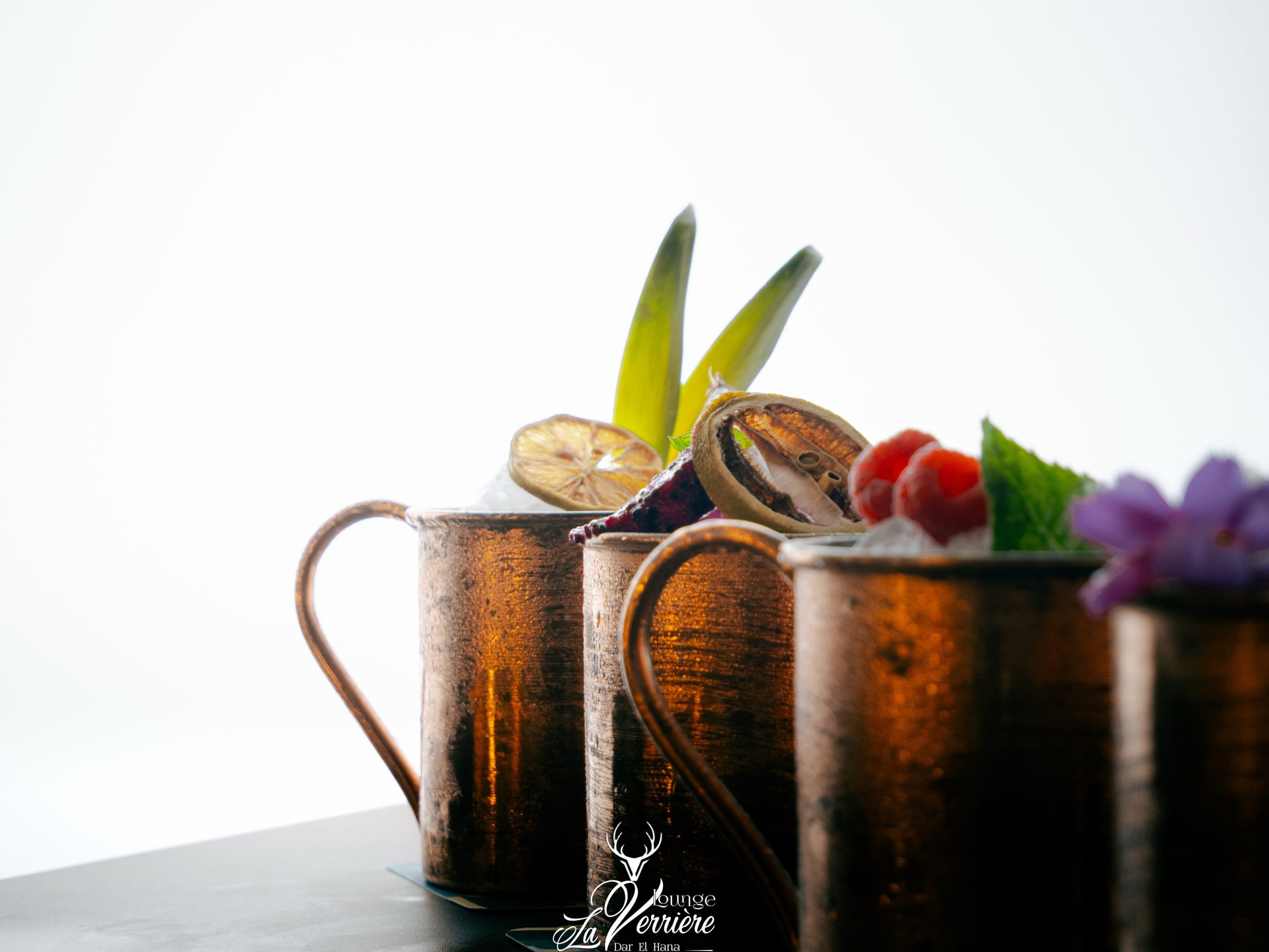 Copper mugs, dried citrus and berries